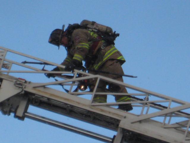Captain Chris Obenchain on the ladder.